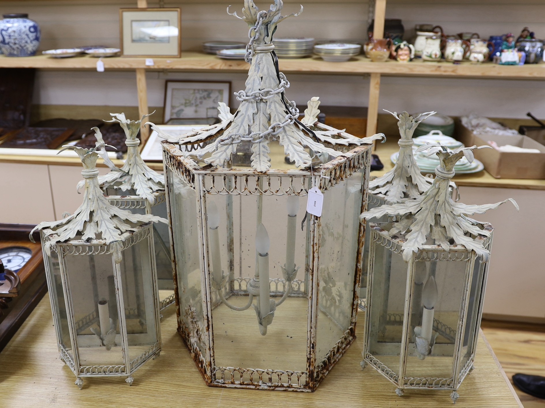 Thomas Messel - A large hexagonal painted hall lantern and a set of four matching wall lights, largest 81cm